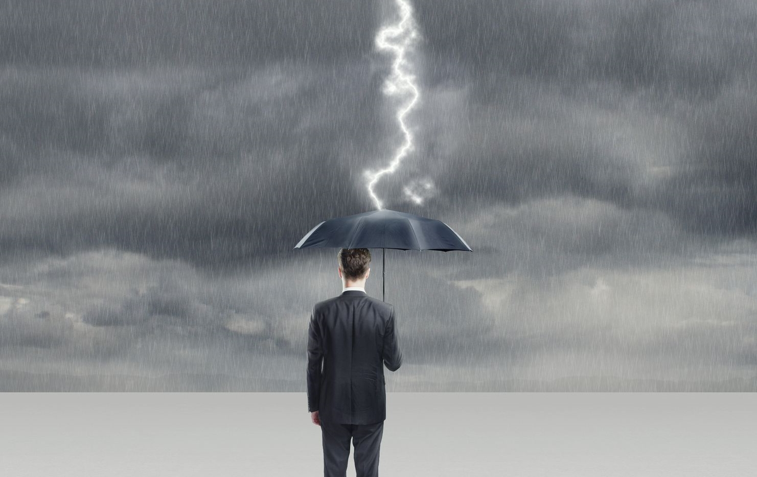 Image of a person with an umbrella during a thunderstorm