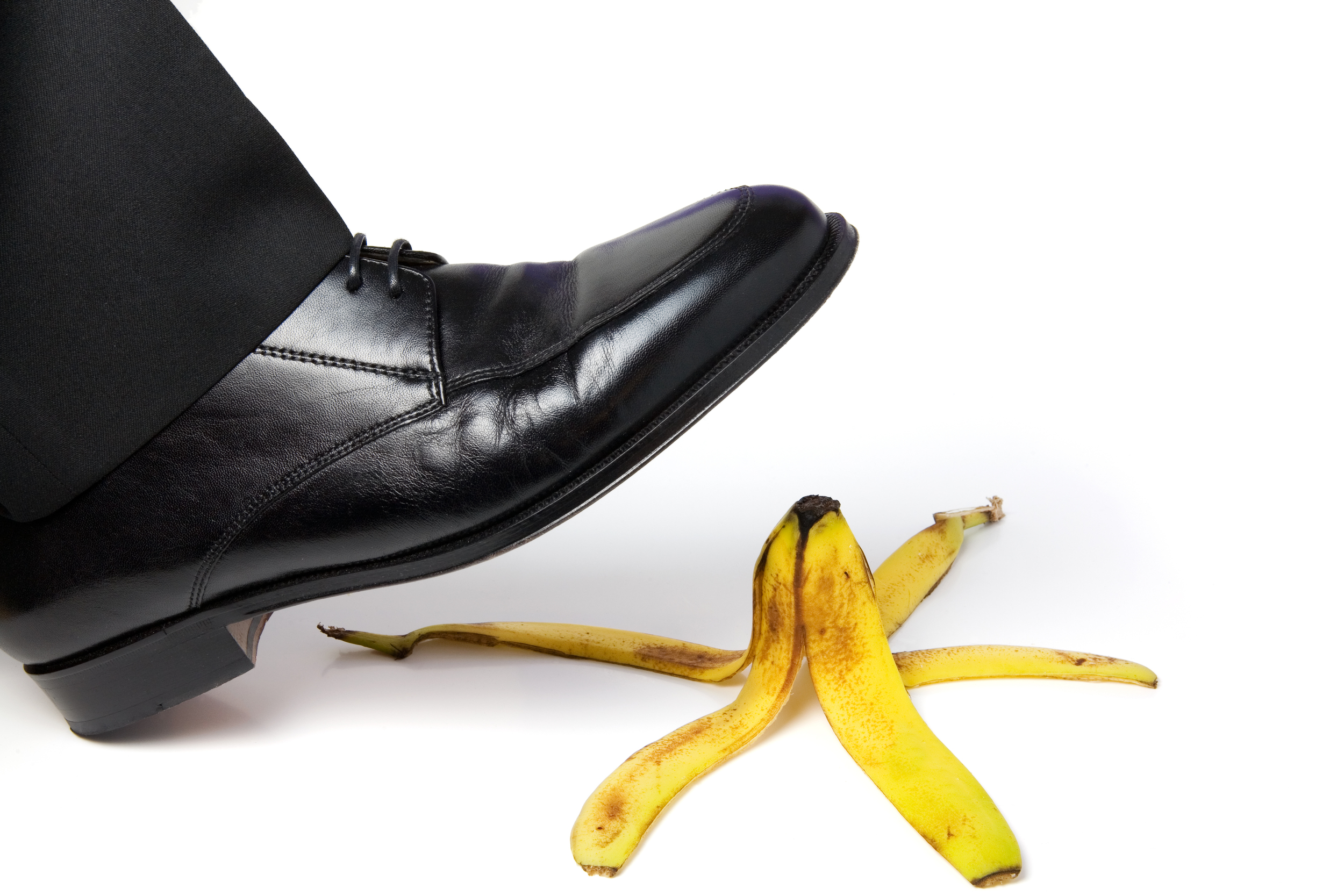 Image of a shoe about to slip on a banana peel
